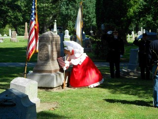Civilian Jo places American Flag on Medallion